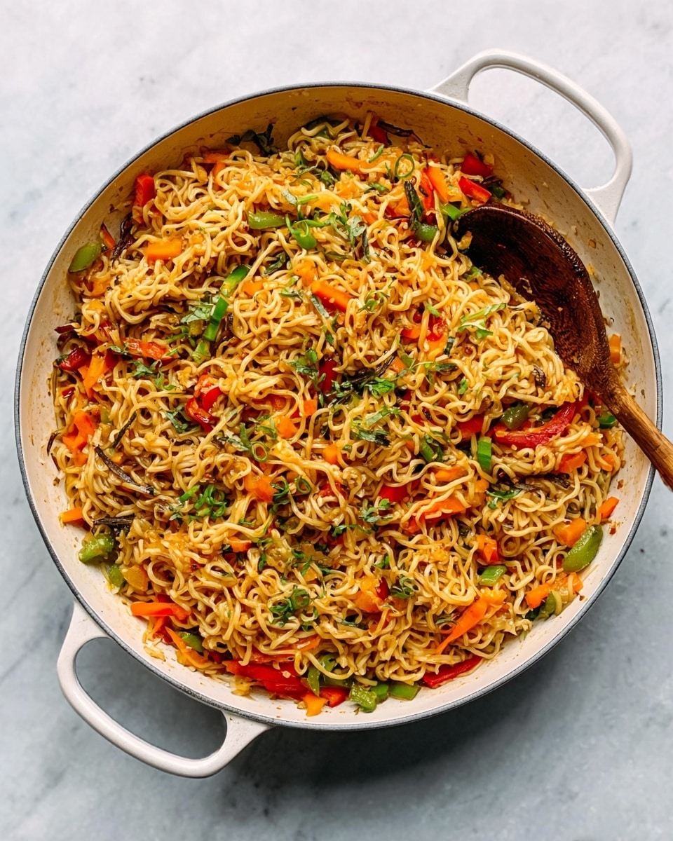 A cast iron pan filled with cooked noodles mixed with various vegetables appears on a white marbled surface. The noodles are light brown and cover the entire pan. On top, strips of red and yellow bell peppers add bright color, along with scattered pieces of green leafy herbs. The vegetables and herbs are spread unevenly across the noodles, giving the dish a fresh and vibrant look. The pan handle is visible, and the photo taken with an iphone --ar 4:5 --v 7